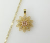 Dainty multicolor star pendant suspended from a 2mm gold plated chain.