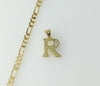 Gold plated figaro chain necklace with small letter R pendant detail.

Gold plated chain necklace featuring a small lett