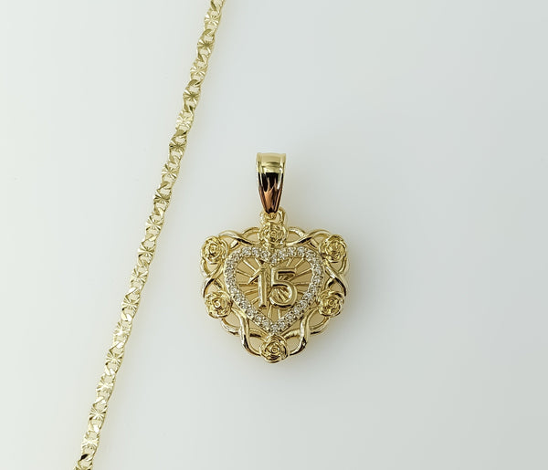 A dainty heart shaped necklace on a gold plated star chain and 2.5mm quince chain.