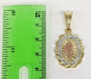 A gold-plated pendant featuring a Virgin Mary with star design

A gold-plated pendant with a star symbol and delicate de