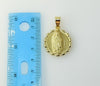 A 3D Virgin Mary figurine pendant with intricate details
A close-up of a gold-plated Virgin Mary pendant 
A Virgin Mary