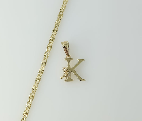 Gold plated star chain necklace with a dainty letter "K" pendant.

Gold plated chain necklace featuring a small letter "