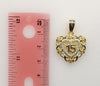 Dainty gold plated heart pendant with a small star symbol inside.
Gold platted heart shape pendant with intricate star d