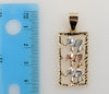 A gold-plated elephant pendant with intricate tri-color design.
A gold-plated pendant featuring an elephant in a tri-col