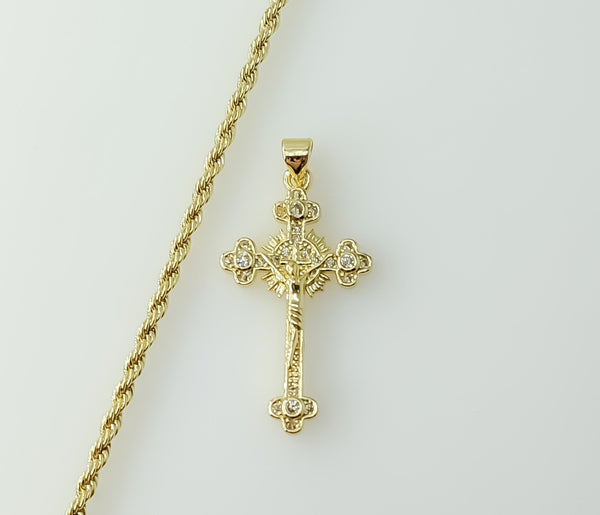 Gold plated small cross pendant on a braided chain necklace.

Gold plated small cross pendant on a rope chain necklace.
