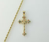 Gold plated small cross Jesus crucifix pendant on a braided chain necklace.
A small gold plated cross Jesus crucifix pen