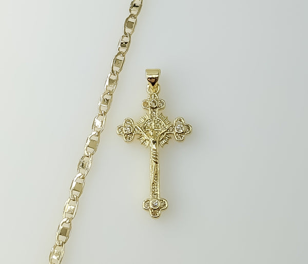A gold plated mariner anchor chain necklace with a small cross pendant.

A gold plated chain necklace with a small cross