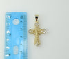 A small gold-plated cross pendant with a flat anchor design.
A gold-plated flat anchor pendant symbolizing protection an