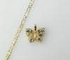 Dainty gold-plated figaro chain necklace with small butterfly pendant and delicate chain.

Gold-plated chain necklace fe