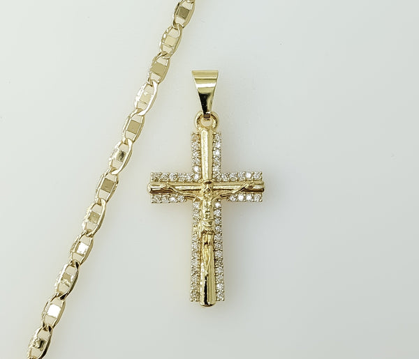 A gold plated mariner anchor chain necklace with small cross pendant.

A small gold plated cross pendant on a 3mm flat m