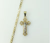 Gold-plated tri-color cross pendant on a 4mm figaro chain necklace.
