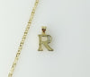Gold plated star chain necklace with dainty letter "R" pendant attached.