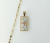 Gold plated mariner anchor chain necklace with tri-color design and elephant charm.
Gold plated flat anchor chain neckla