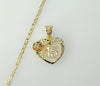 Gold plated heart pendant on a star-chain necklace with a quince charm.