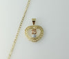 Tri-color plated 14K gold 3mm Cuban chain necklace with a heart charm.
