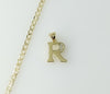 14k gold plated dainty Cuban chain necklace with a small letter R pendant.

14k gold plated Cuban link chain necklace fe