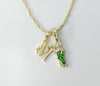 Gold plated multicolor Saint Jude pendants on a 14K twist chain necklace.