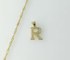 Gold plated 14K twist chain necklace with small letter "R" pendant.

Gold plated 14K chain necklace featuring small engr