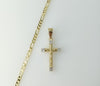 Gold plated Figaro chain necklace with small cross pendant and delicate design.