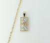 Gold plated star-shaped chain necklace with elephant accents and three-link design.

Gold plated three-link chain neckla