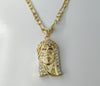 Gold plated 14K diamond cut Figaro chain Jesus style necklace with pendant.

Gold plated 14K diamond cut Figaro chain Je