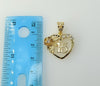 Dainty gold-plated heart pendant with intricate details and texture.
Delicate gold-plated heart-shaped locket with a sub