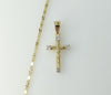 Gold plated small star-shaped chain necklace with a cross charm.