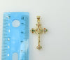 Gold plated crucifix pendant featuring a small Jesus cross design.
Small cross pendant with intricate Jesus crucifix det