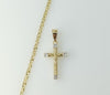 Gold plated small star design necklace with delicate chain chain detail.
Gold plated small cross pendant hanging from a