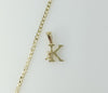 A delicate 14K gold plated Cuban chain necklace with a small letter K pendant.

A 14K gold plated dainty Cuban chain nec